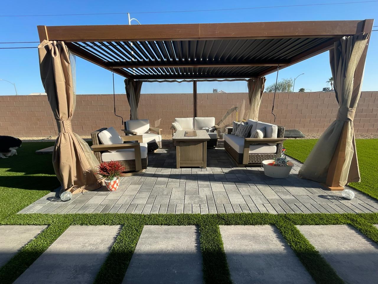 Turf and paver patio under a pergola in Las Vegas